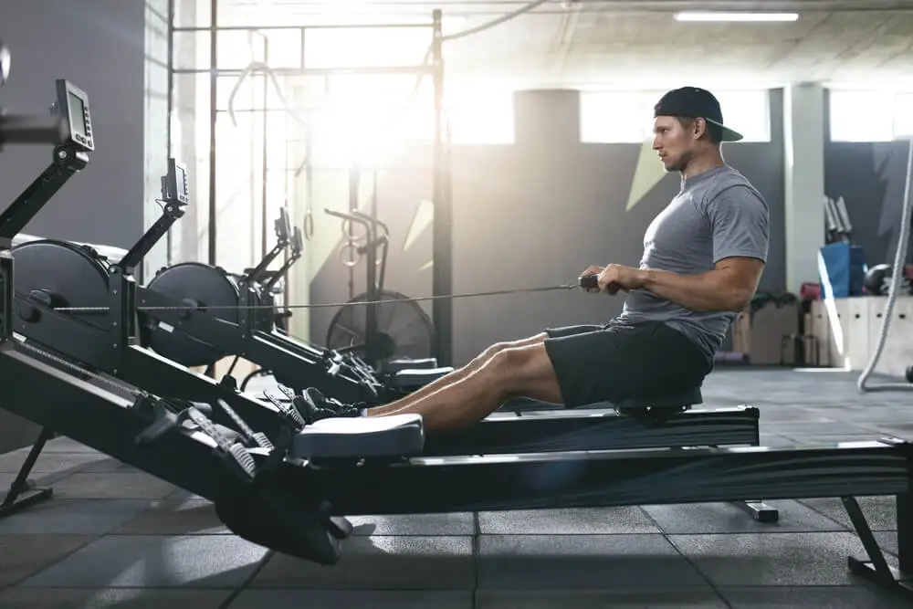 A man trains on a rower machine to compare before and after results