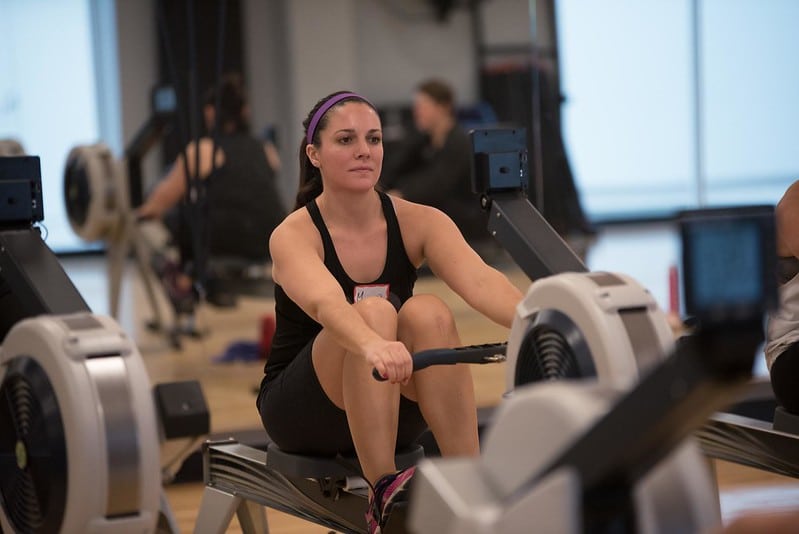 a woman doing a 30 days rowing machine training
