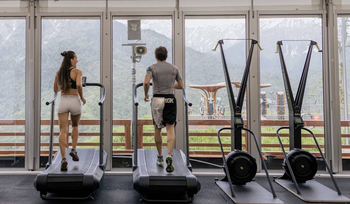 Two people doing treadmill workouts for weight loss