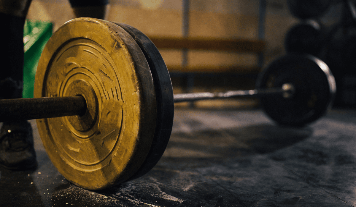a barbell on the floor in a gym to prepare for the 2023 CrossFit Open