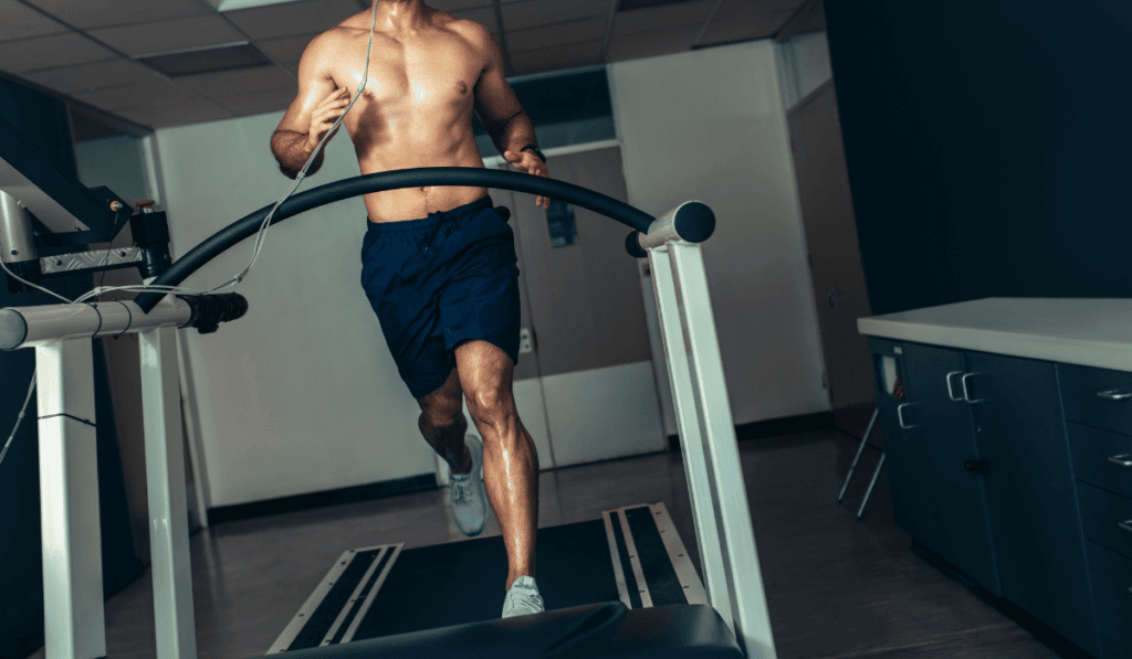 A man exercising on a treadmill after discovering what are treadmills