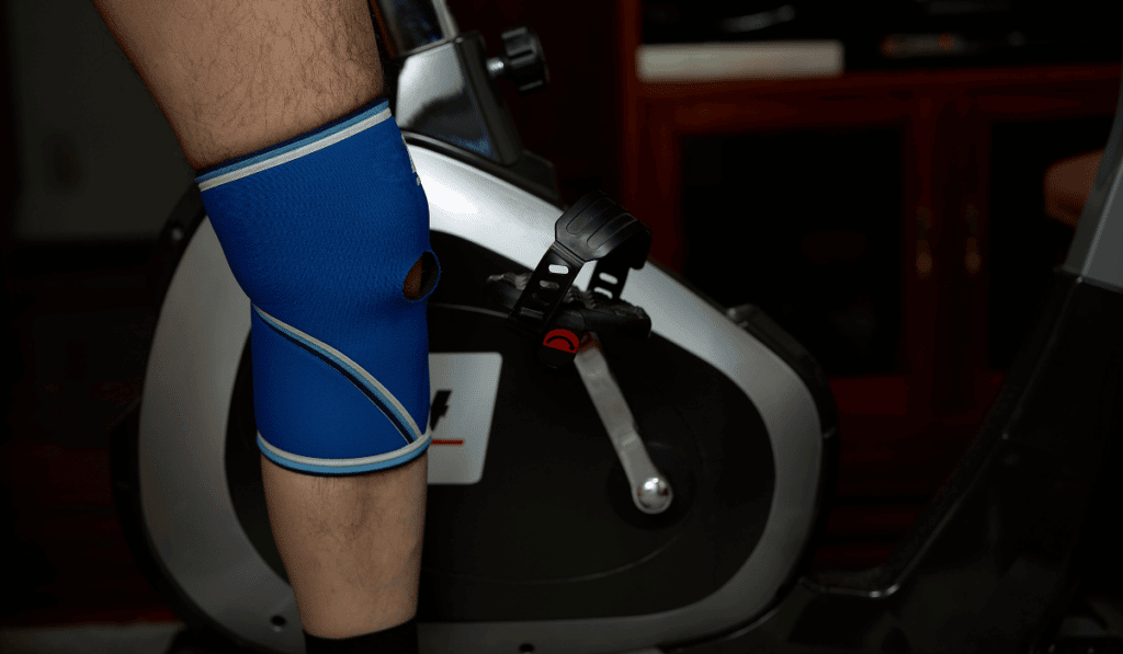 A man with a knee pain after he felt knee pain on elliptical