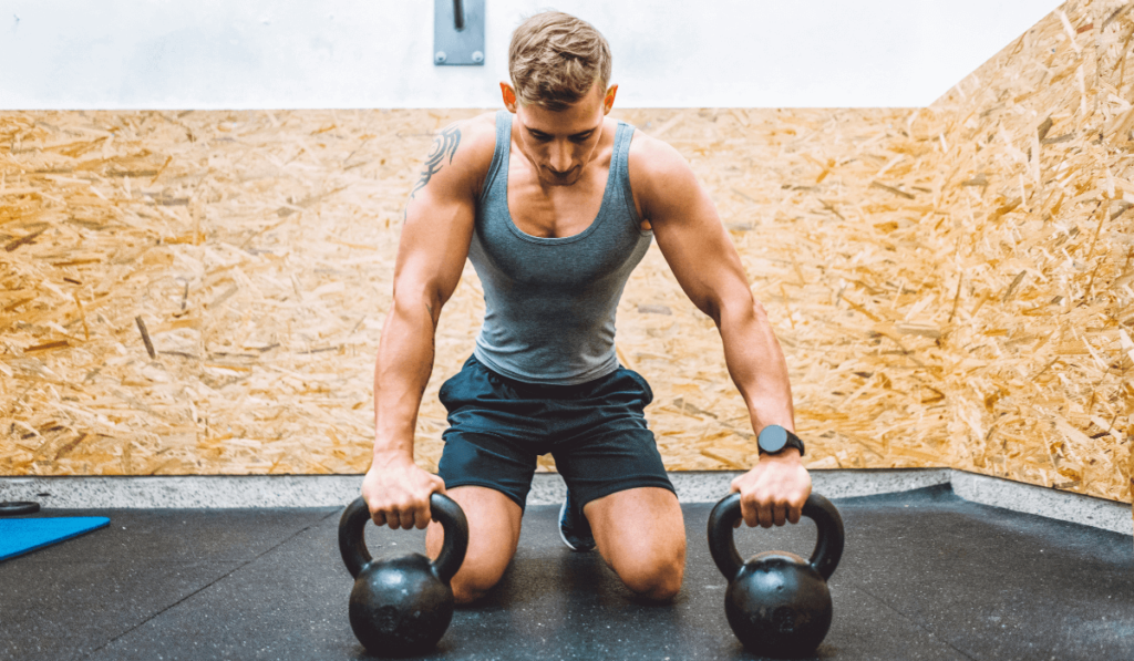 A toned man working out to show kettlebell results