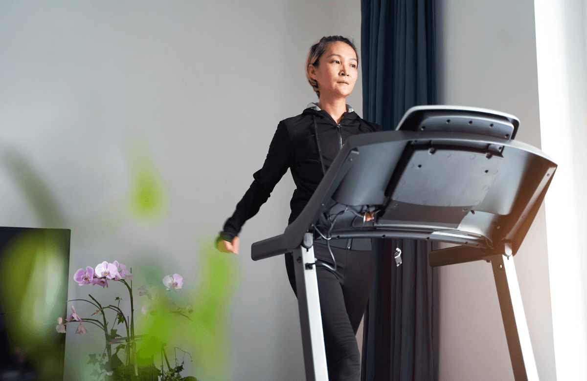 A woman running on the best treadmill for home use