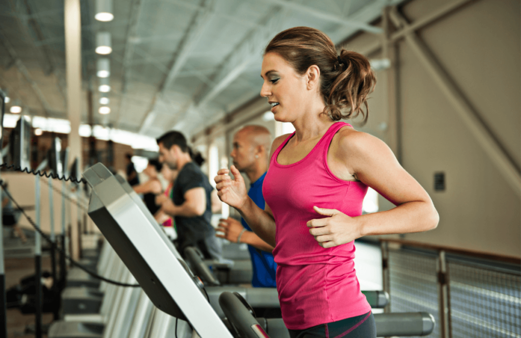 A woman knowing how to reset a NordicTrack treadmill