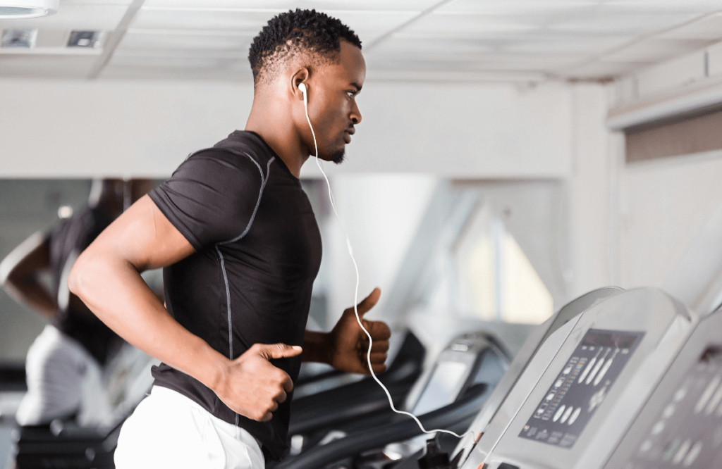 A young man using the best treadmills for running
