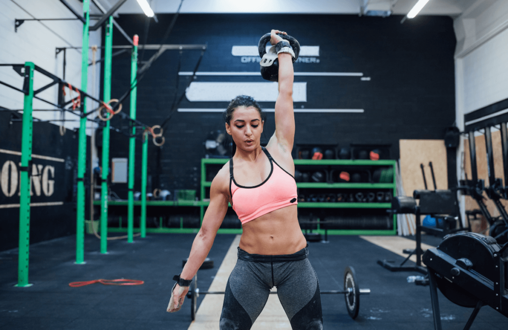 A woman doing kettlebell hamstring exercises