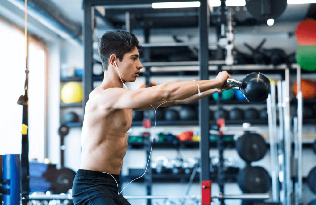 A man doing kettlebell hamstring exercises