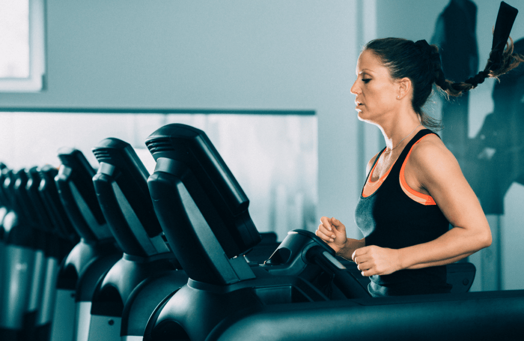 A woman running on the best Proform treadmill