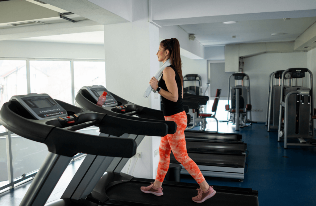 A woman at the gym running on the quietest treadmill