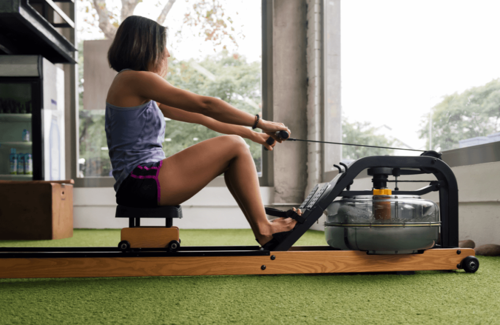 A woman wondering which rower between Water Rower vs Concept 2 is the best