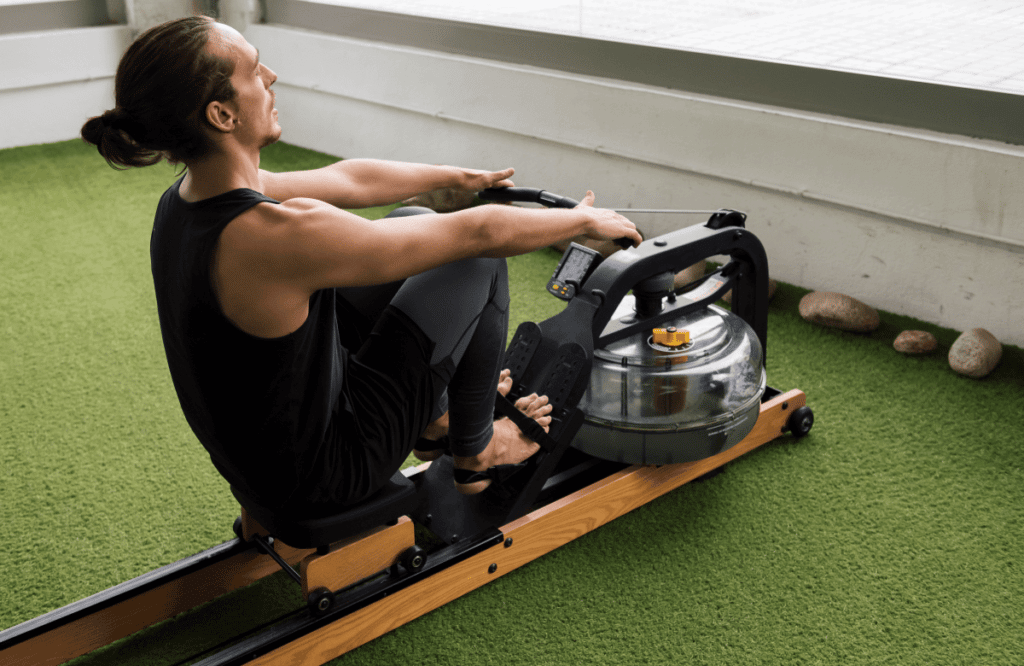 A man at home trying Water Rower vs Concept 2