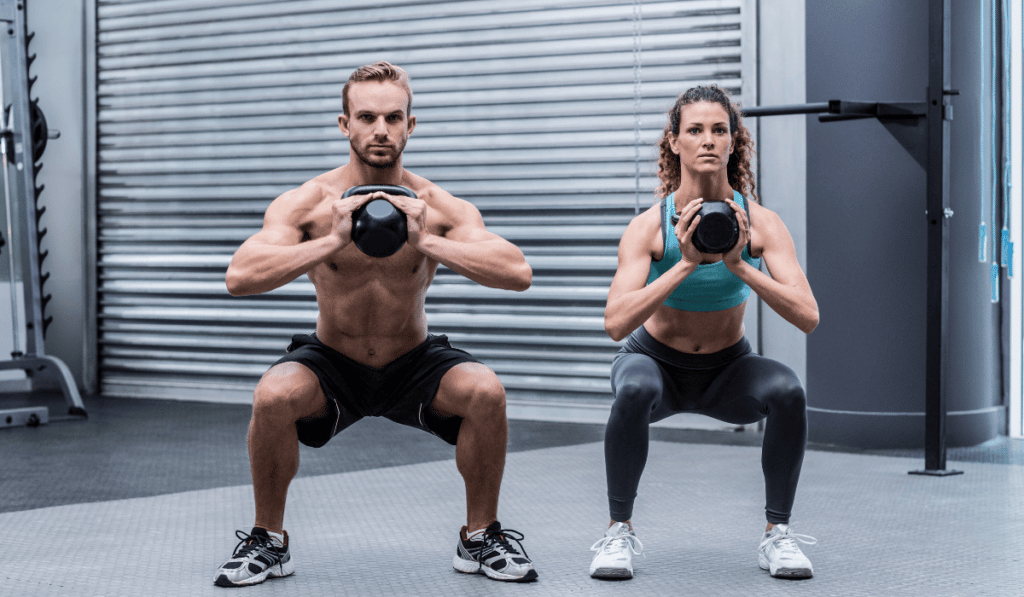 A man and a woman doing IKFF Level 2 test for their kettlebell challenges