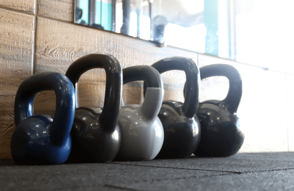 Different sizes of kettlebells used for the kettlebell halo exercise