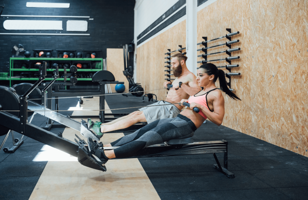 A couple working out using rowing machine accessories
