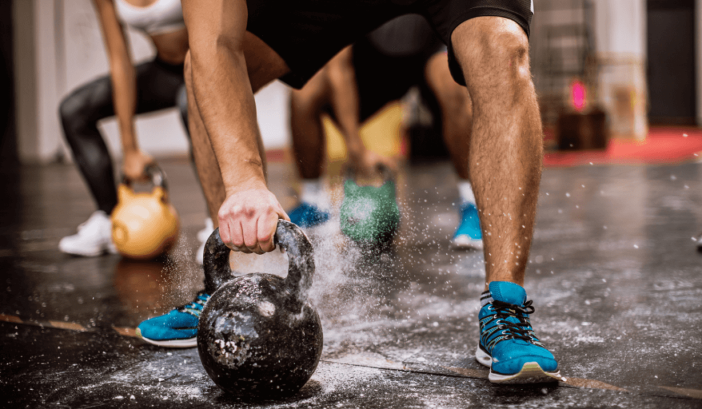 Someone trying beginner kettlebell exercises