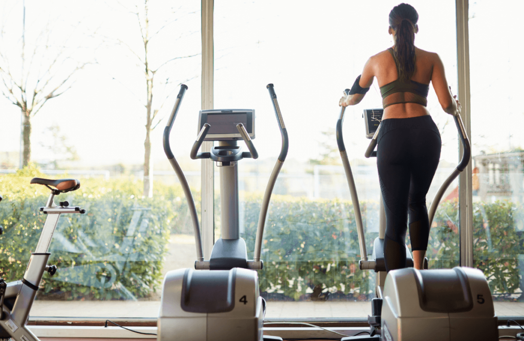 Someone working out knowing how to lose weight on elliptical