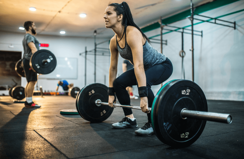 A woman at the gym showing deadlift muscles worked