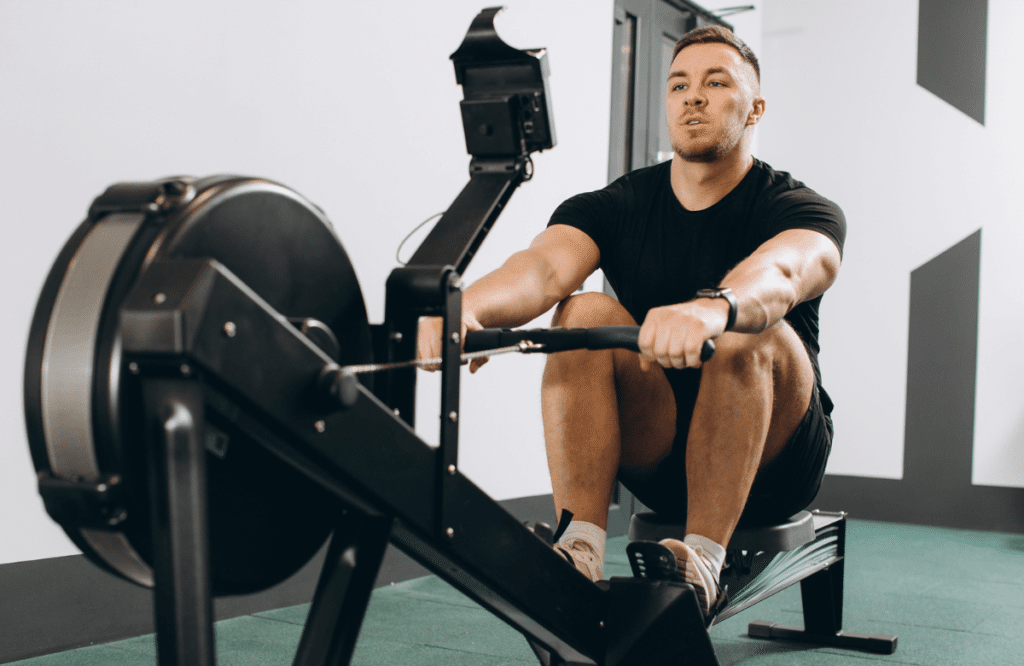 A man using one of the best rowing machines