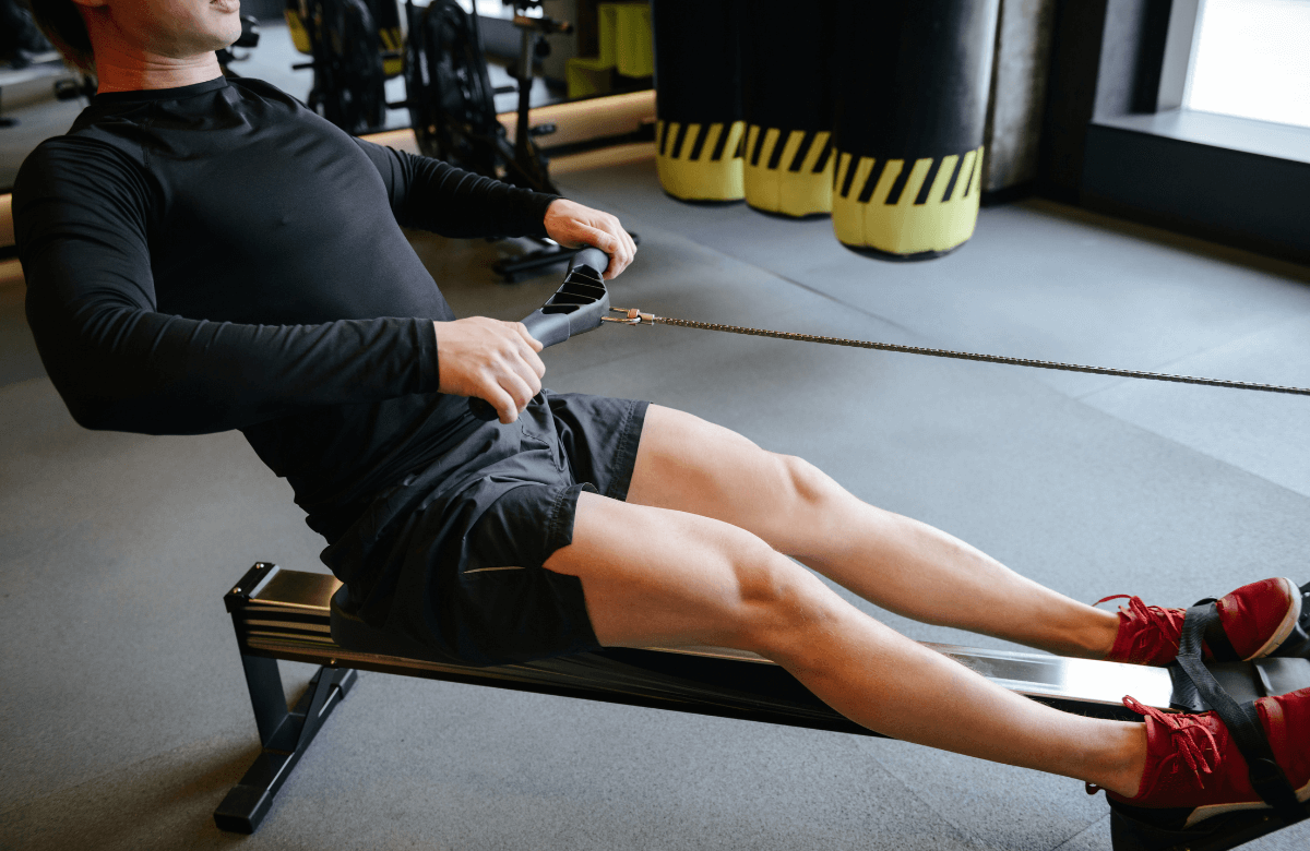 A man trying some of the best rowing machine for beginners at the gym