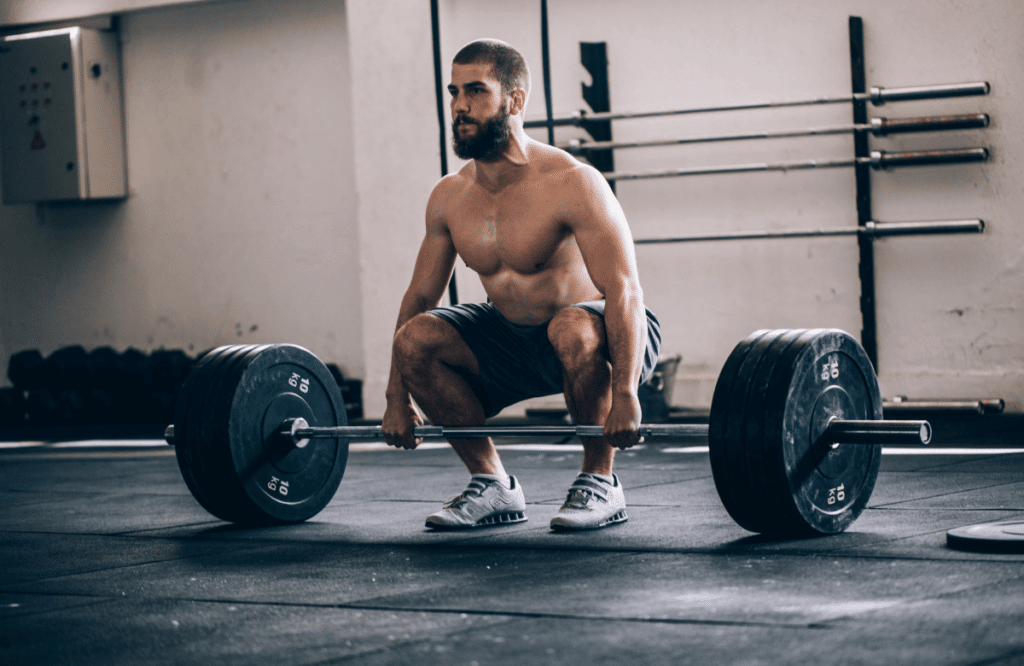 A man performing block pull deadlifts