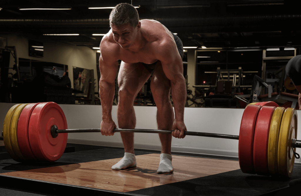 A strong man at the gym to illustrate deadlifting before and after transformation