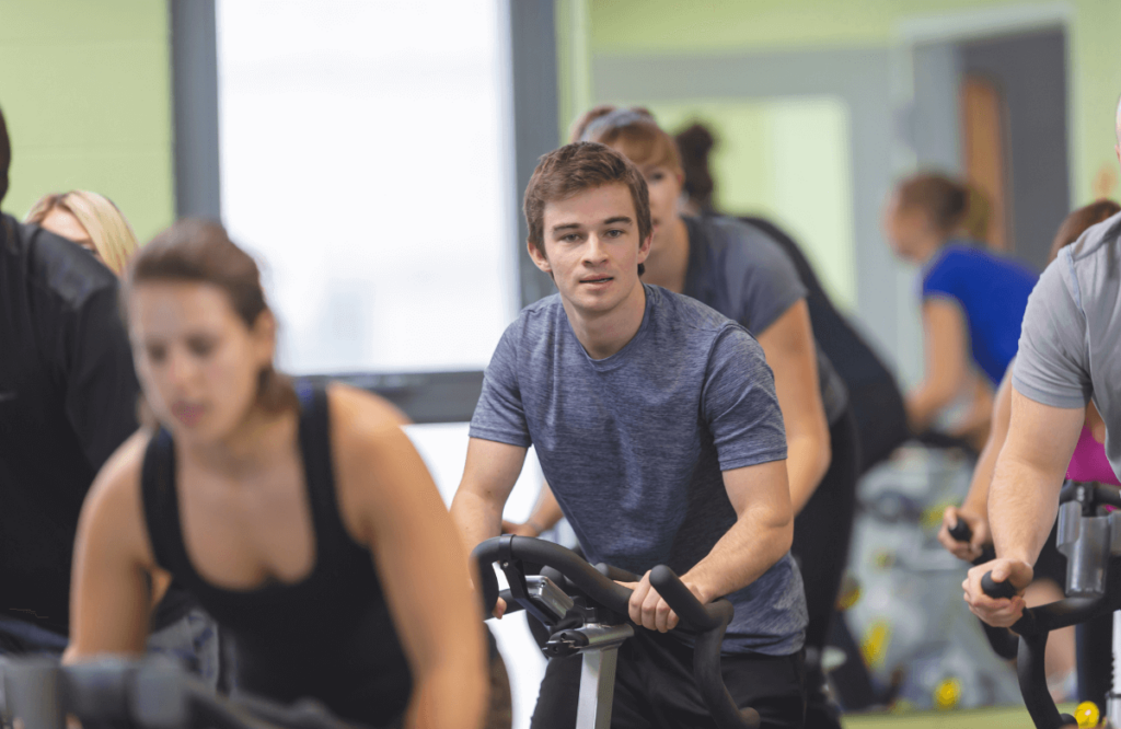 A group of people doing an elliptical vs bike comparison