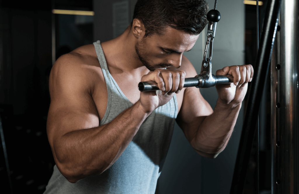 A former skinny guy gaining muscle at the gym