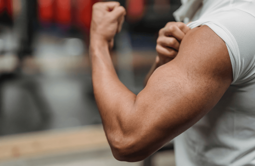 A man showing his bicepts to show how long does it take to notice weight loss