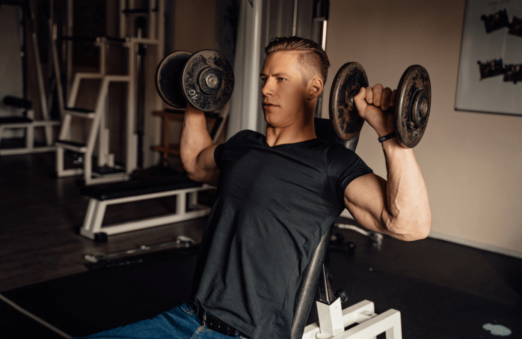 A muscular man weightlifting to compare cardio vs weights for weight loss