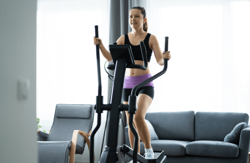 A woman doing exercises after finding how elliptical work abs