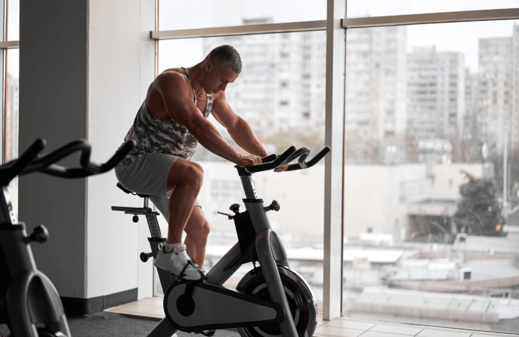 A man using a stationary bike instead of a treadmill