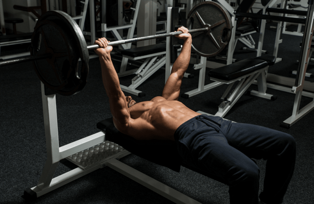 A muscular man doing workout to lose fat and gain muscle