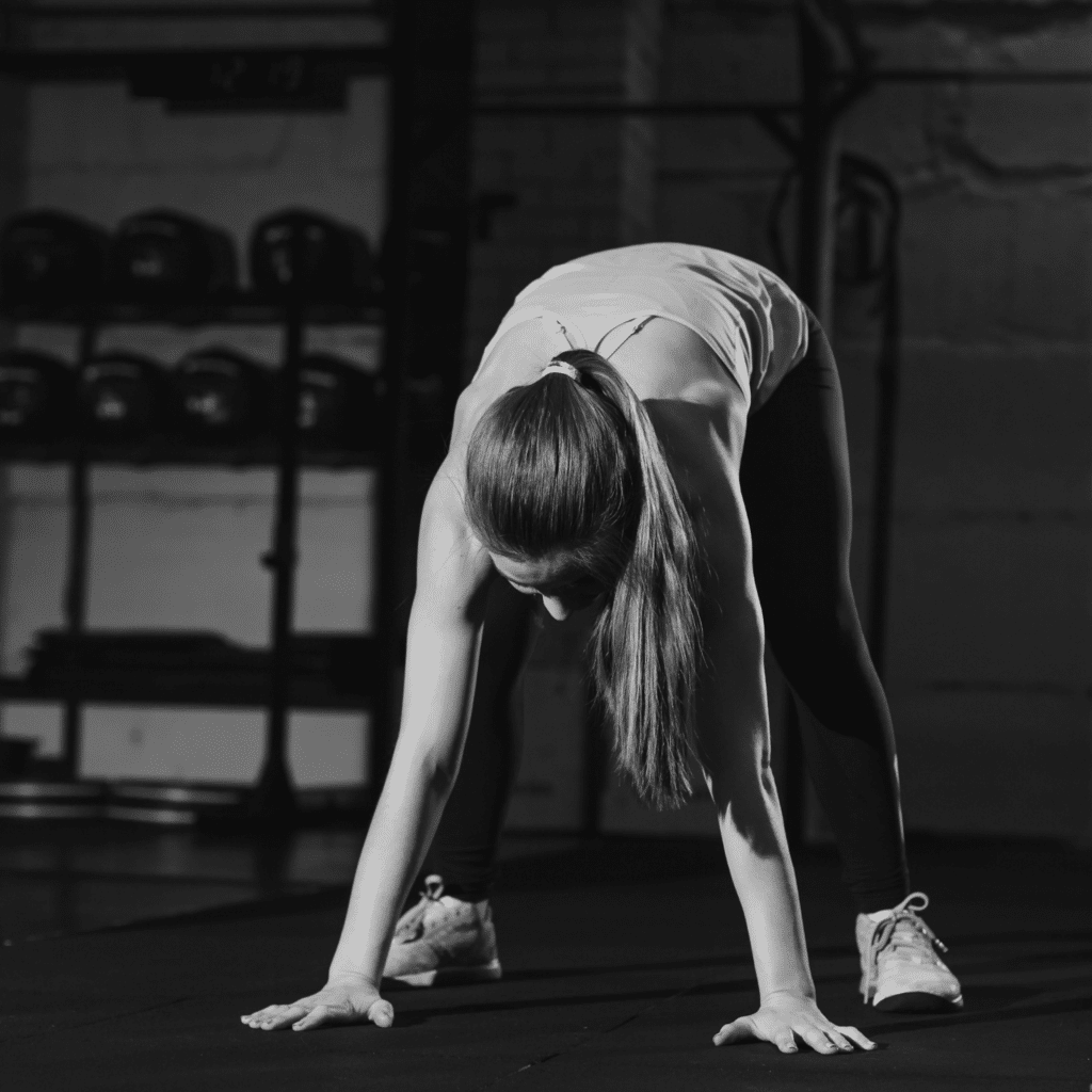 A woman following the best deadlift warm-up before her workout