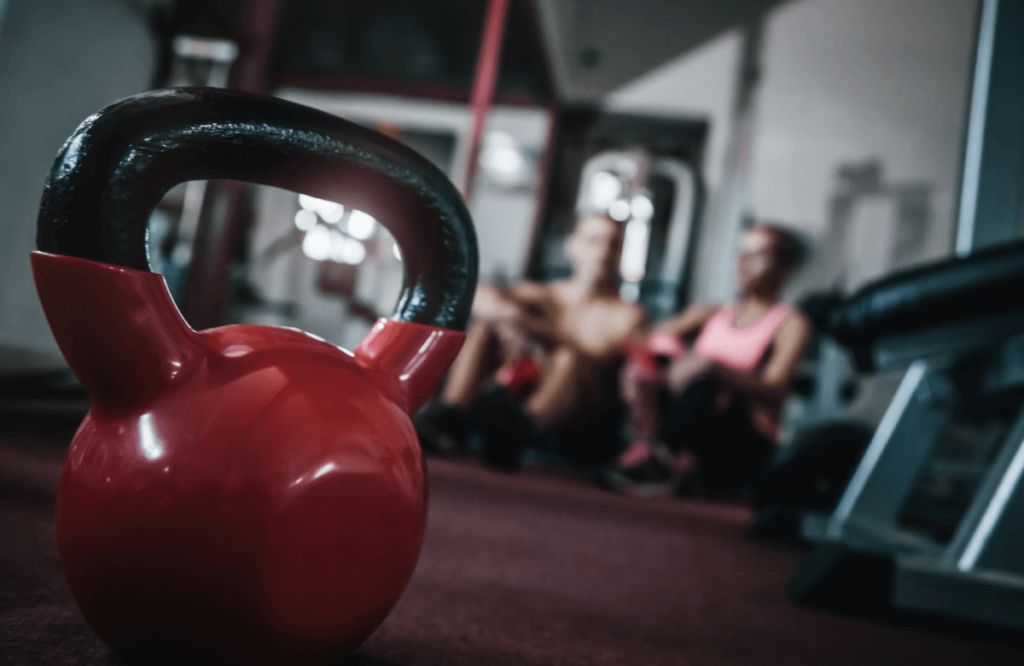 Two friends wondering what are the muscle worked by kettlebell high pulls