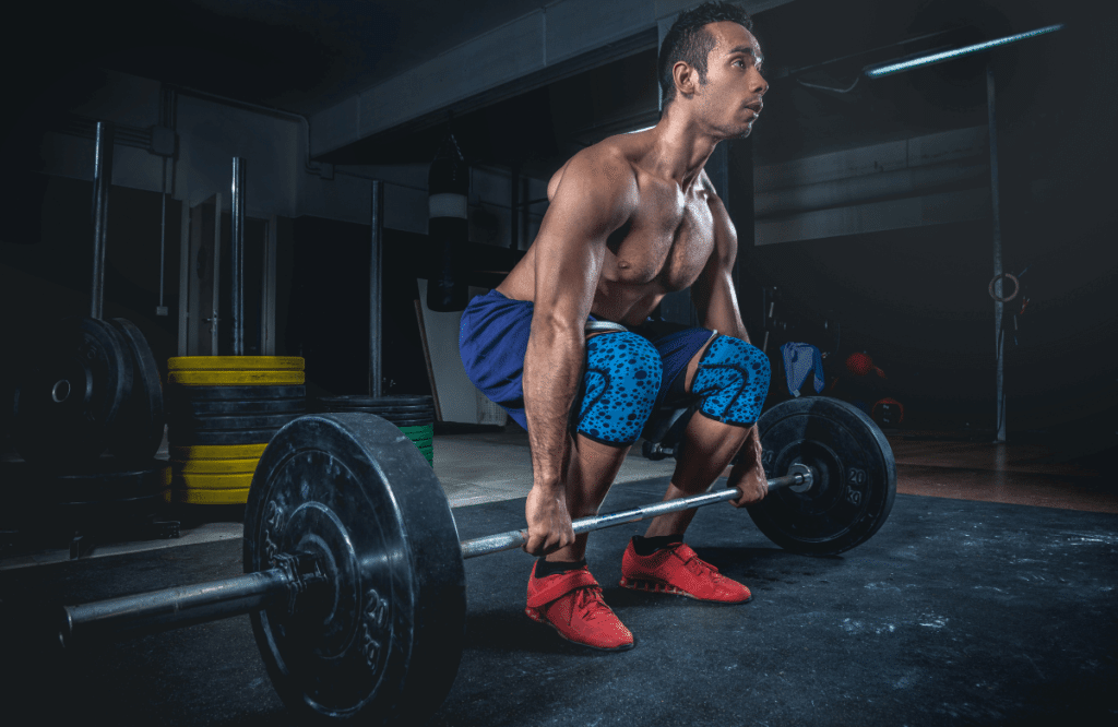 An athlete doing the pause deadlift workout
