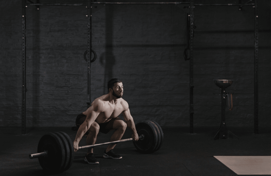A strong man at the gym to illustrate the deadlifting before and after transformation