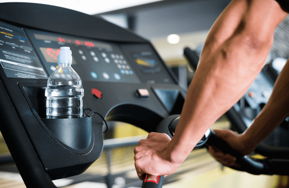 A man using a treadmill to try the treadmill vs bike comparison