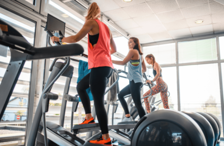 Women at the gym using the best affordable elliptical