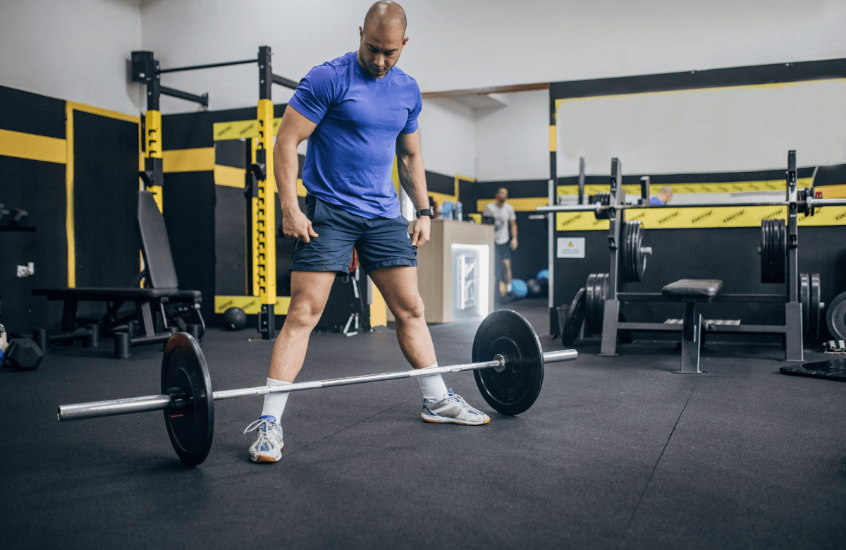 A man about to deadlift using german volume training plan