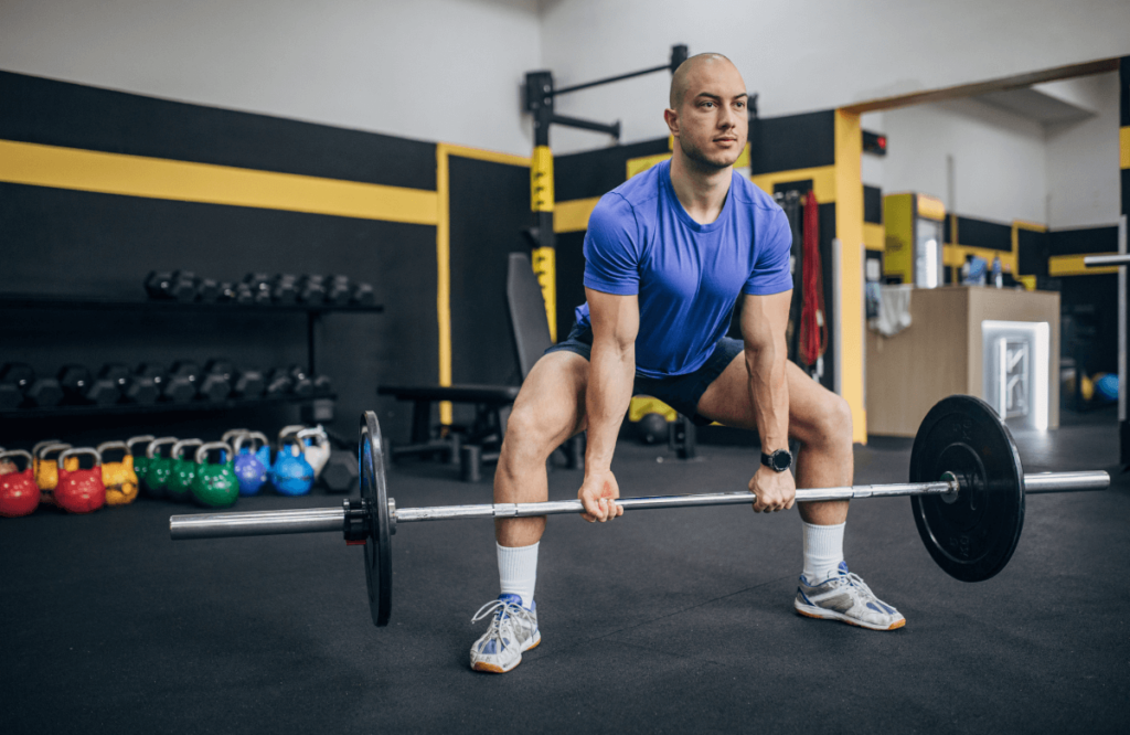 A man performing the best deadlifts for glutes