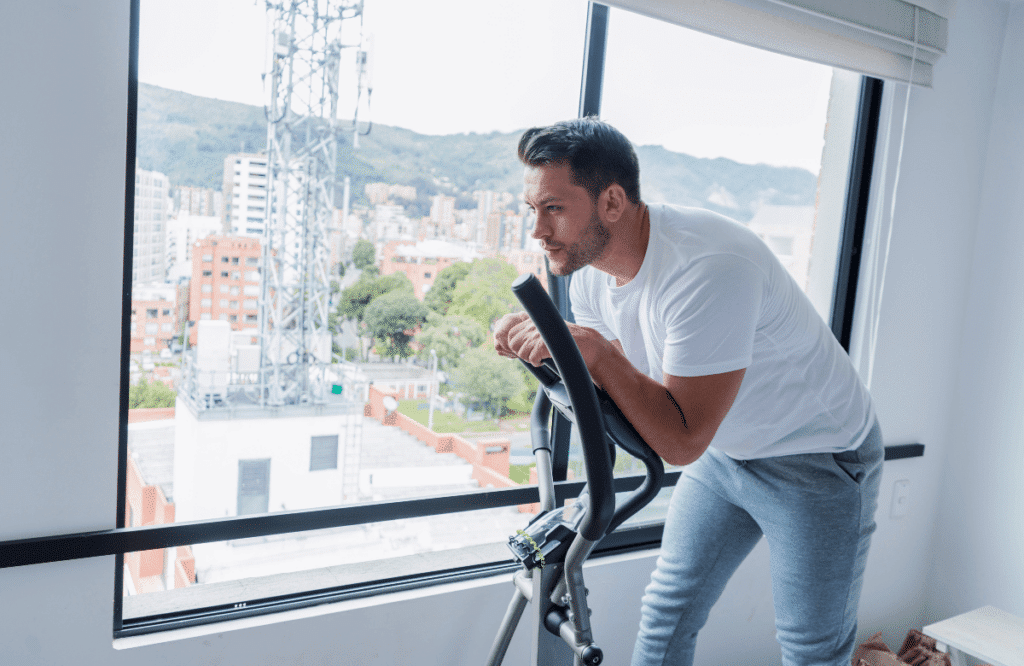 A man trying the best ellipticals for apartment available
