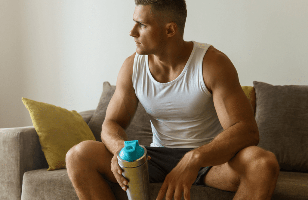 A man taking a creatine shake