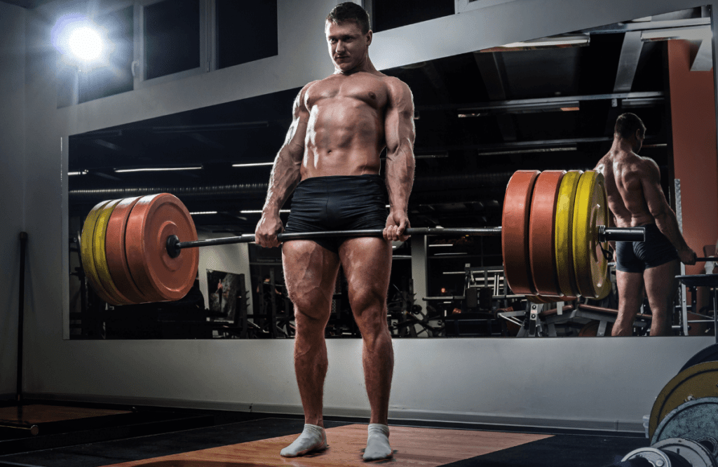 A man doing rack deadlifts