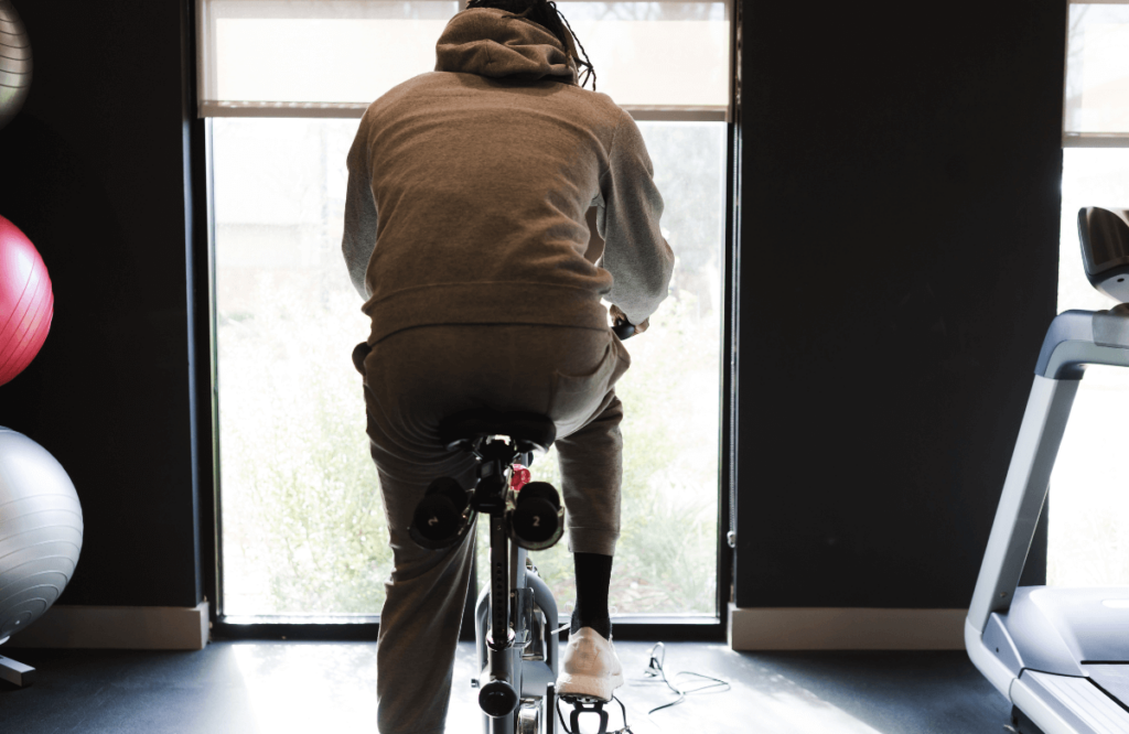 A man at the gym using the best elliptical bike