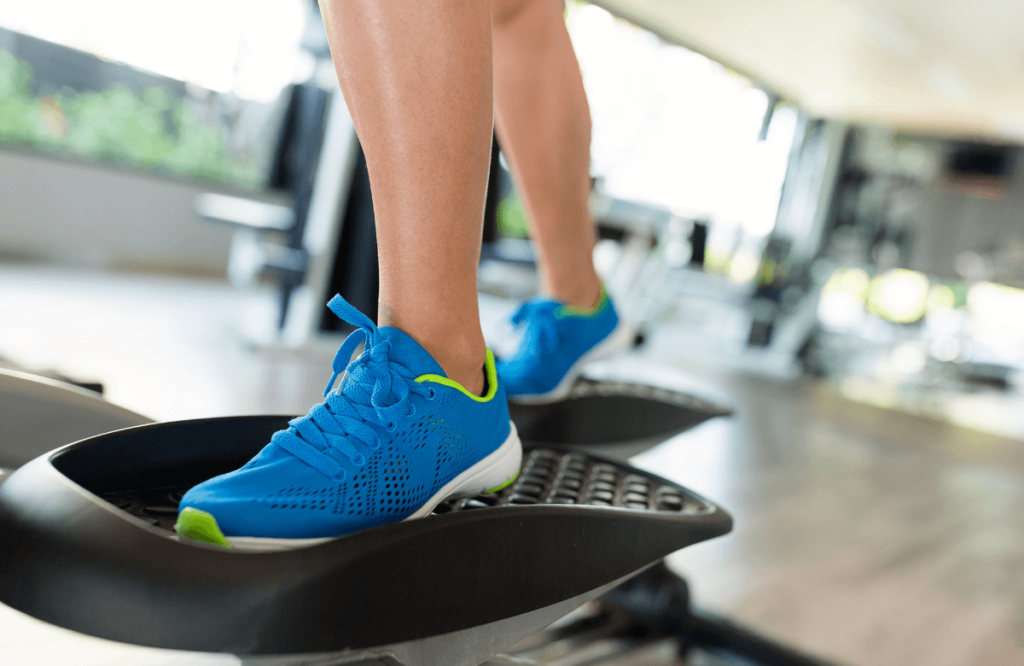 Someone using the best shoes for elliptical at home