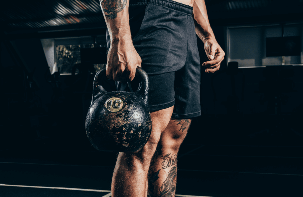 A muscular man who found the right adjustable kettlebell for his workout