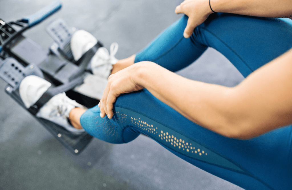 A woman programming her low row machine