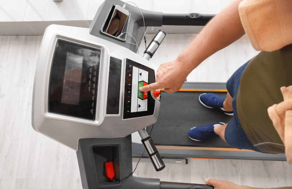 A man preparing his best treadmill under $1000 using the screen