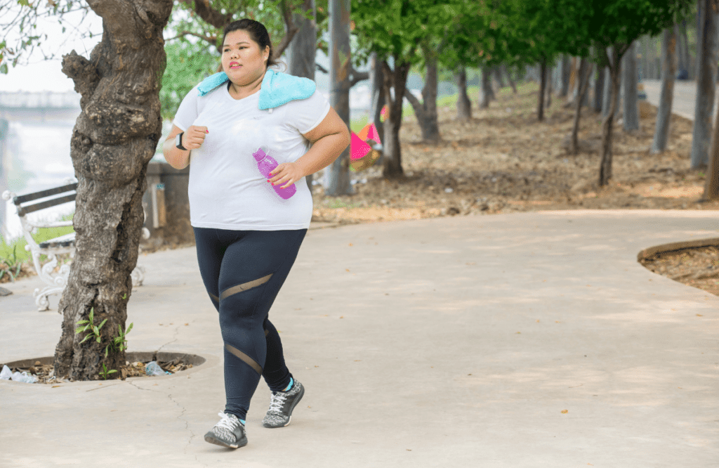 An obese woman exercising to lose weight